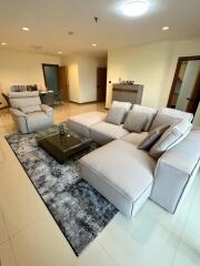 Modern living room with sectional sofa and dining area