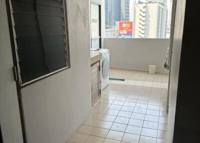 Utility area with washing machine and city view