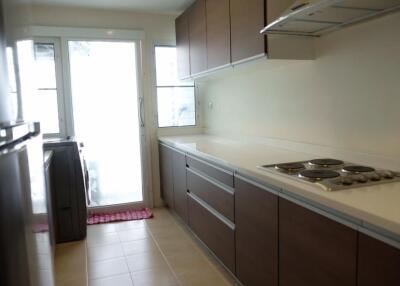 Modern kitchen with built-in stovetop and ample countertop space