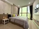 Modern bedroom with large window and city view