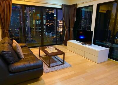 Modern living room with city view at night