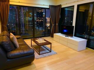 Modern living room with city view at night