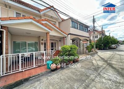 Outside view of a residential property with a gated entrance