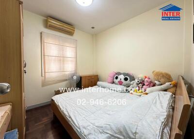 Comfy bedroom with plush toys and wooden furniture