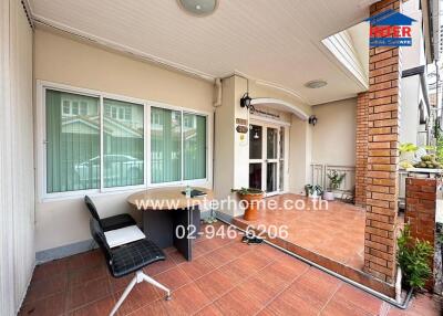 Outdoor patio area with seating and decor