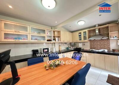 Modern kitchen with wooden cabinets and appliances