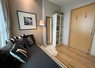 Cozy bedroom with modern decor and ample natural light