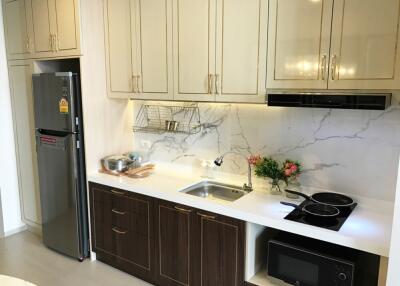 Modern kitchen with sleek cabinets and appliances