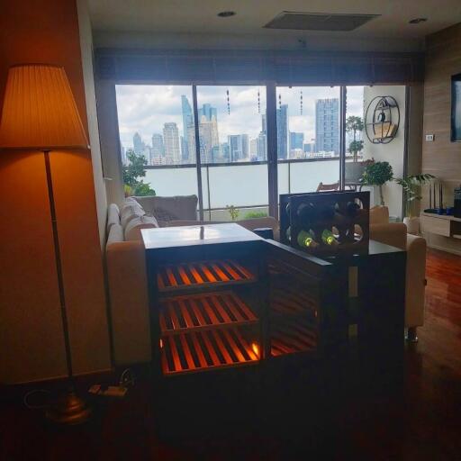 Main living area with large windows overlooking a city skyline