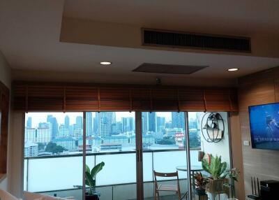 Spacious living room with a view of the city skyline