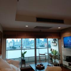 Spacious living room with a view of the city skyline