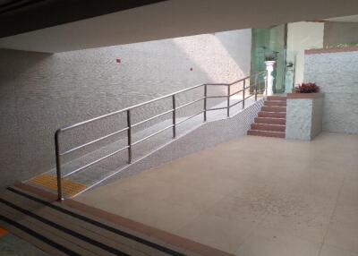 Building entrance with ramp and stairs