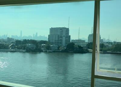 Large window with a scenic view of the city and river