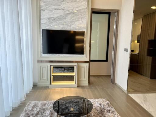 Modern living room with a TV and a rug