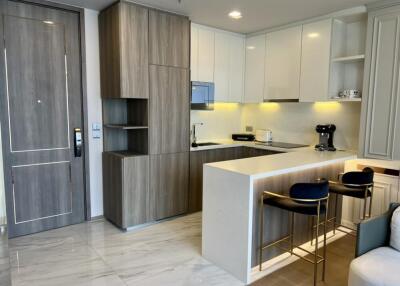 Modern kitchen with wooden cabinets and an island bar