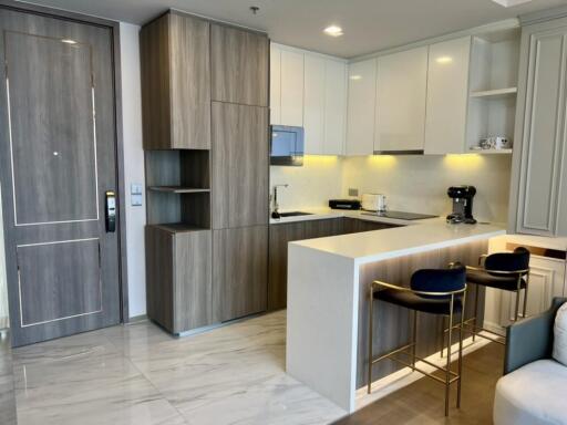 Modern kitchen with wooden cabinets and an island bar