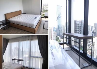 Spacious bedroom with large windows offering city views and modern furnishings