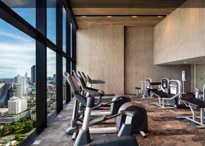 Modern fitness room with a view of the city