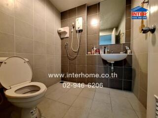 Modern bathroom with tiled walls and fixtures