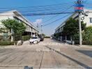 Street view of residential area with houses and cars