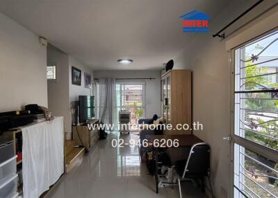 Living room with dining area and view to garden