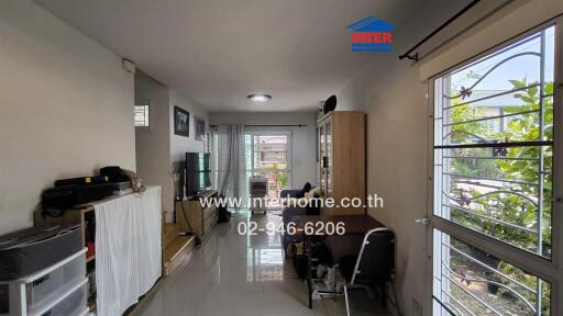 Living room with dining area and view to garden