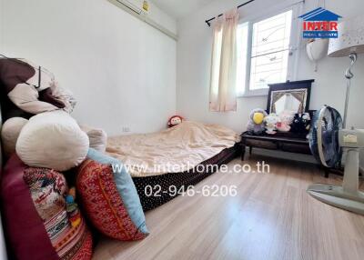 Cozy bedroom with single bed and stuffed animals