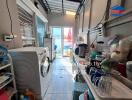 Laundry room with washer and various household items