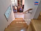 Indoor staircase with wooden steps leading to the lower floor