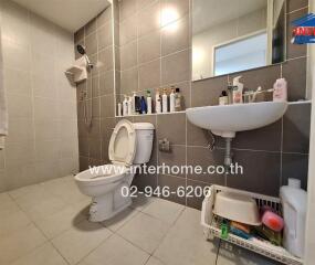 Modern bathroom with shower, toilet, and sink