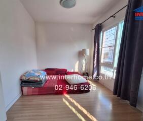 Minimalist bedroom with futon and natural light