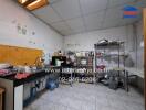 Standard kitchen with various appliances and storage shelves