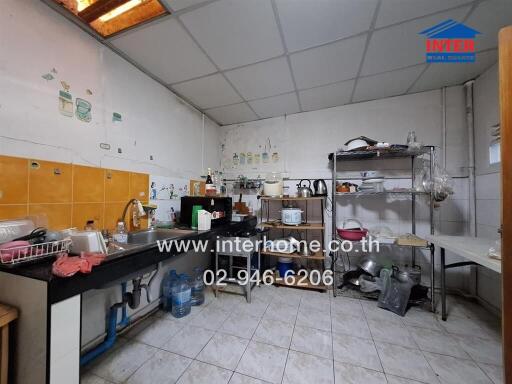 Standard kitchen with various appliances and storage shelves