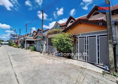 Street view with row of residential buildings on a sunny day