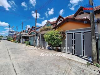 Street view with row of residential buildings on a sunny day