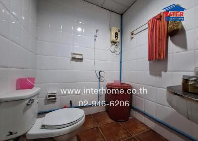 Bathroom with toilet and utilities