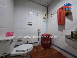 Bathroom with toilet and utilities