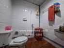 Bathroom with toilet and utilities