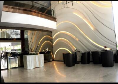 Modern lobby with elegant lighting and reception area