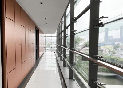 modern hallway with large windows and city view