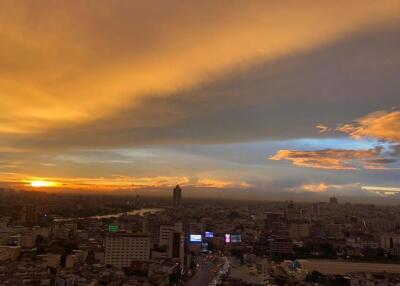 Aerial view of a city at sunset