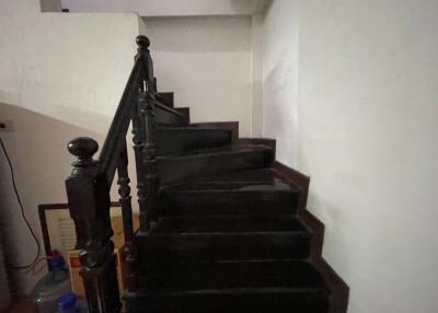 Interior staircase with black steps