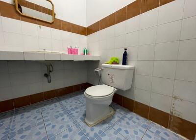 Clean and simple bathroom with a toilet and sink