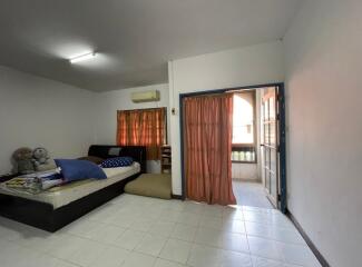 Bedroom with double bed, air conditioning, and balcony access