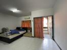 Bedroom with double bed, air conditioning, and balcony access