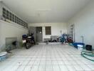 Spacious garage with tile flooring and ample storage