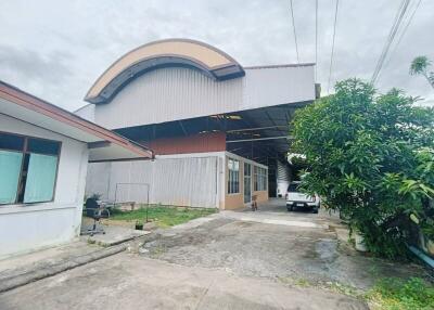 Exterior view of a property with large garage