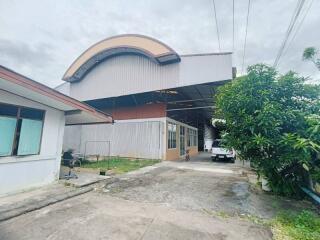 Exterior view of a property with large garage