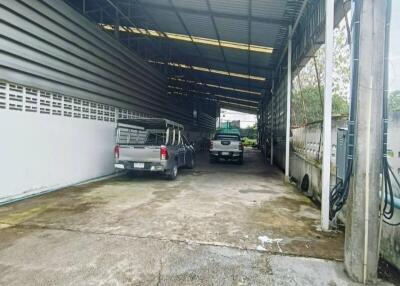 Covered garage with parked vehicles