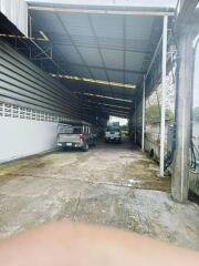 Covered garage with parked vehicles